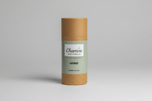 Charieva Naturals deodorant stick with a plant and decorative stones on a dark background